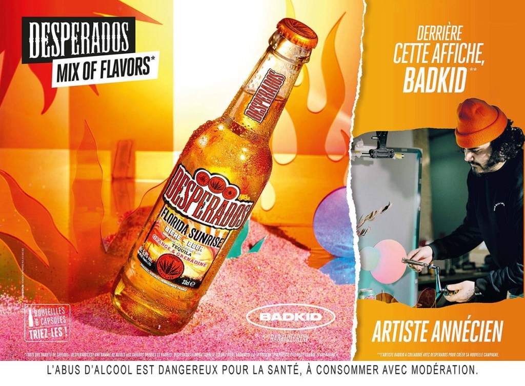 Publicité Desperados - Mix of Flavors -  bouteille de Florida Sunrise - Derrière cette affiche Badkid - Annecy - Agence Service Plan - 2023