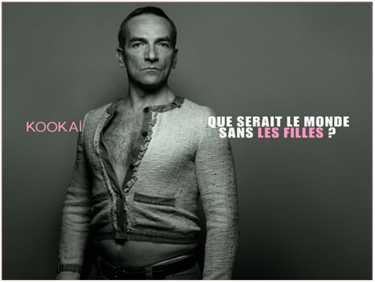 Publicité Kookaï - 2004 - Monde sans filles - Homme travesti - Tailleur