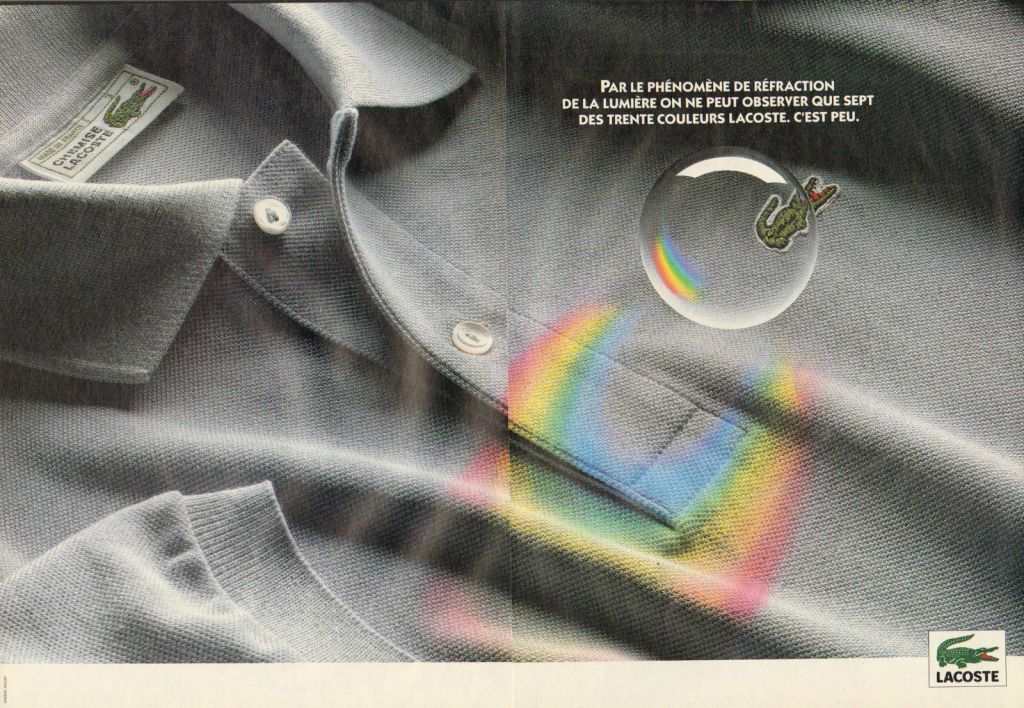 Publicité Lacoste - Double page - Couleur - Polo gris - Par le phénomène de réfraction de la lumière, on ne peut observer que sept des trente couleurs Lacoste. C'est peu  - 1991
