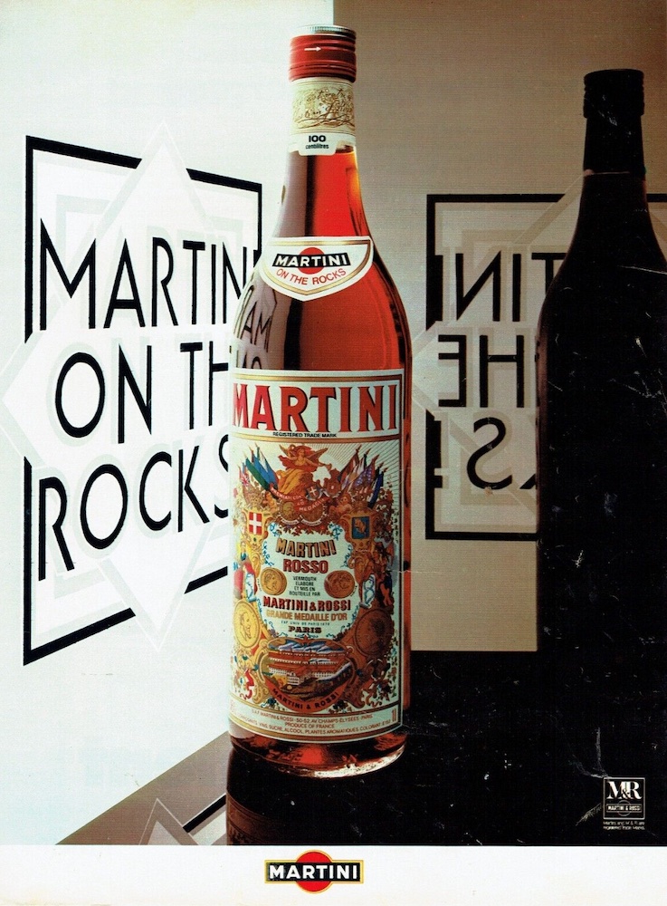 Publicité Martini - On the rocks - Lettres imprimées sur vitre opaque - Bouteille Martini Rosso premier plan - Agence Alice - 1977