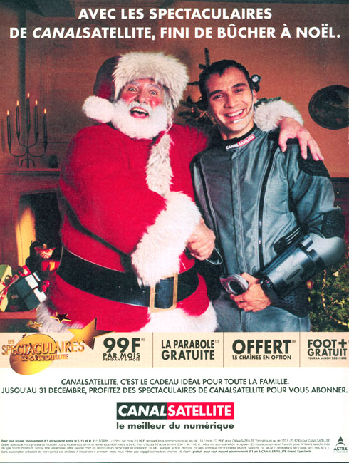Publicité Canal Satellite - Avec les spectaculaires, Fini de bûcher à Noël - Homme en combinaison avec le Père Noël