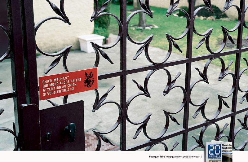 Publicité 20 minutes - Pourquoi faire long quand on peut faire court ? - Panneau de mise en garde chien méchant - Chien méchant qui mord alors faites attention au chien si vous entrez ici - Agence BDDP&Fils - 2004