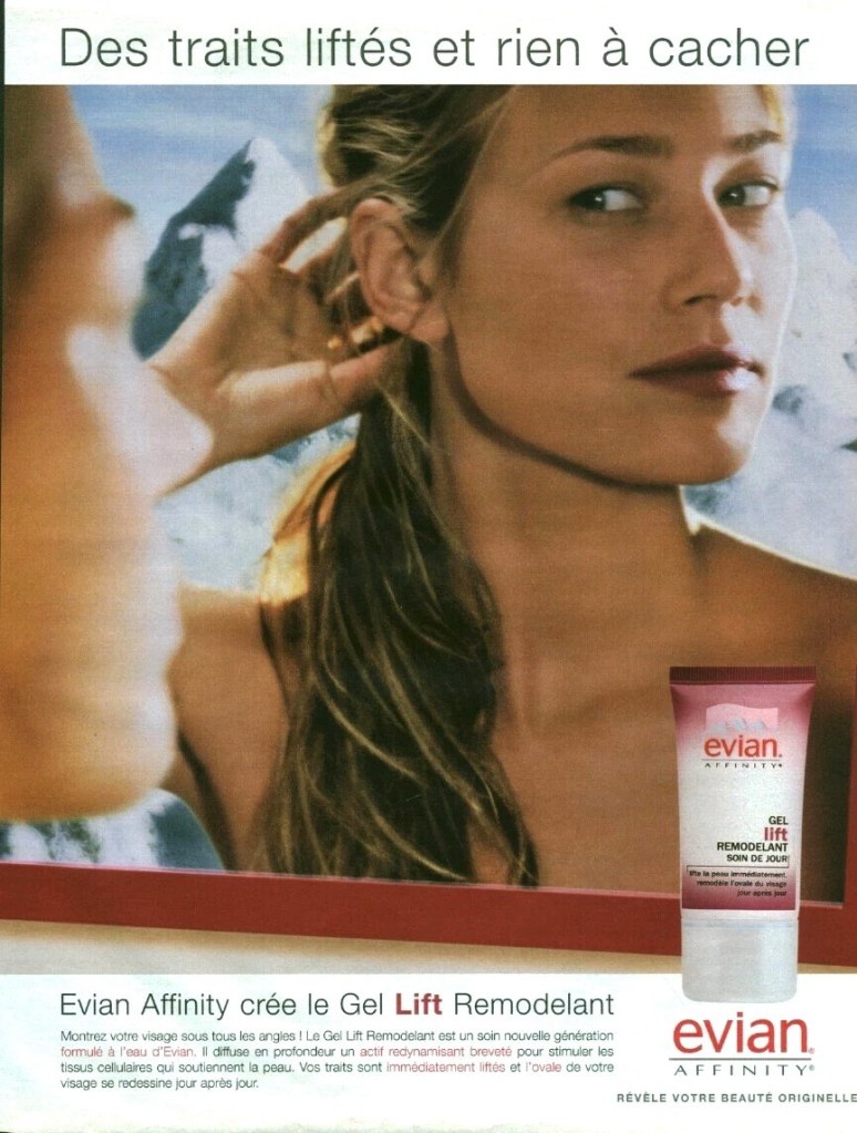 Publicité evian - Affinity - Des traits liftés et rien à cacher - Evian AFFINITY crée le gel Lift remodelant - Femme se regarde dans un miroir, derrière elle un paysage de montagnes - 2003