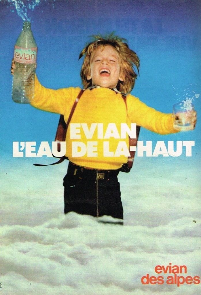 Publicité evian - L'eau de là-haut - Un écolier avec son cartable émerge des nuages - Agence Bélier - 1980