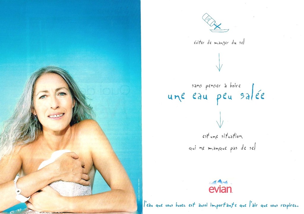 Publicité evian - L'eau que vous buvez est aussi importante que l'air que vous respirez - Une femme, cheveux grisonnants, semble allaiter un enfant - Agence BETC EuroRSCG Paris - 1996