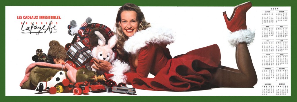 Publicité Galeries Lafayette - Les cadeaux irrésistibles - Estelle Lefébure en mère Noël avec des cadeaux - 1993