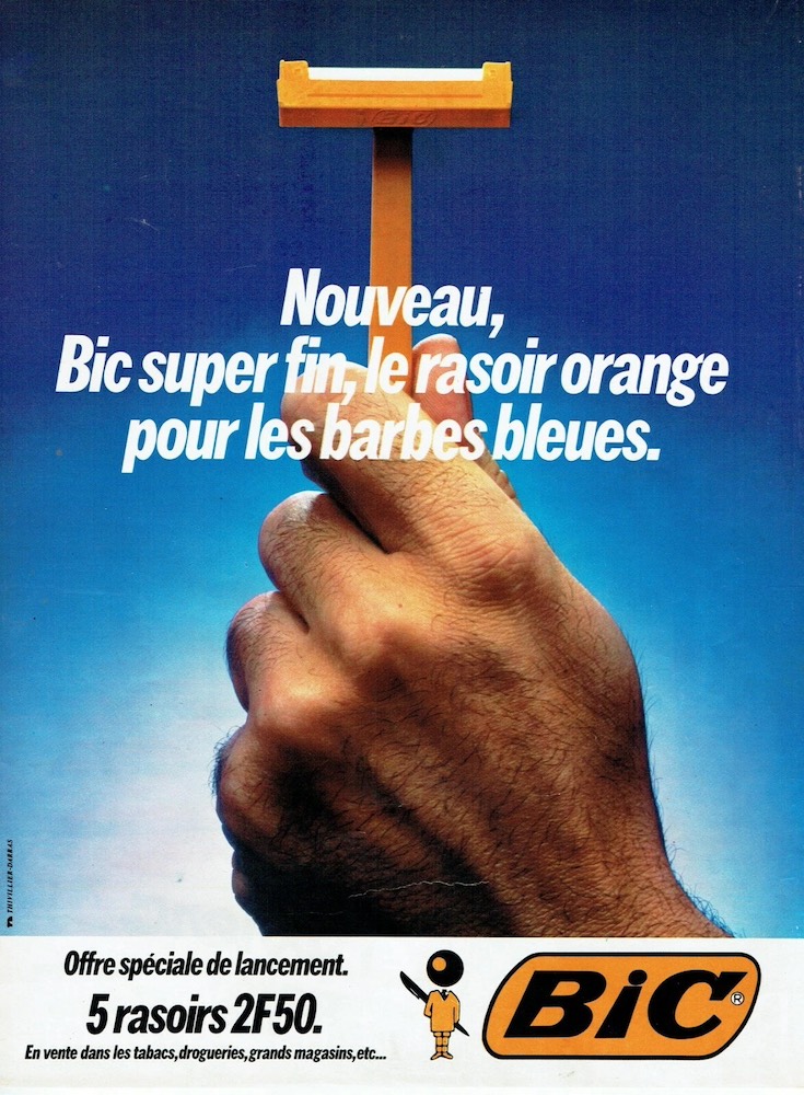 Publicité Bic - Rasoir - Nouveau Bic super fin, le rasoir orange pour les barbes bleues - Main tenant un rasoir - Agence Thivillier-Darras - 1979